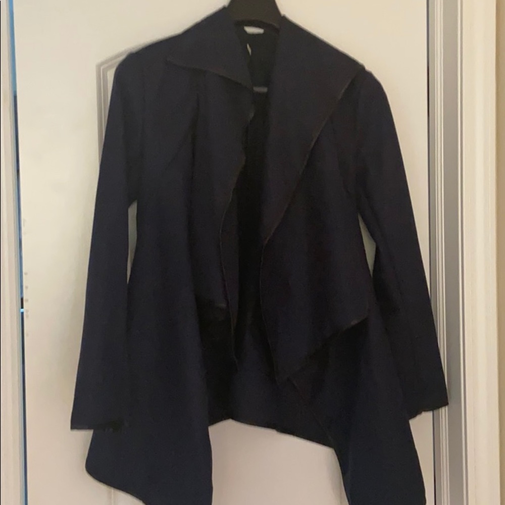 Jacket runs small.  More like a medium.